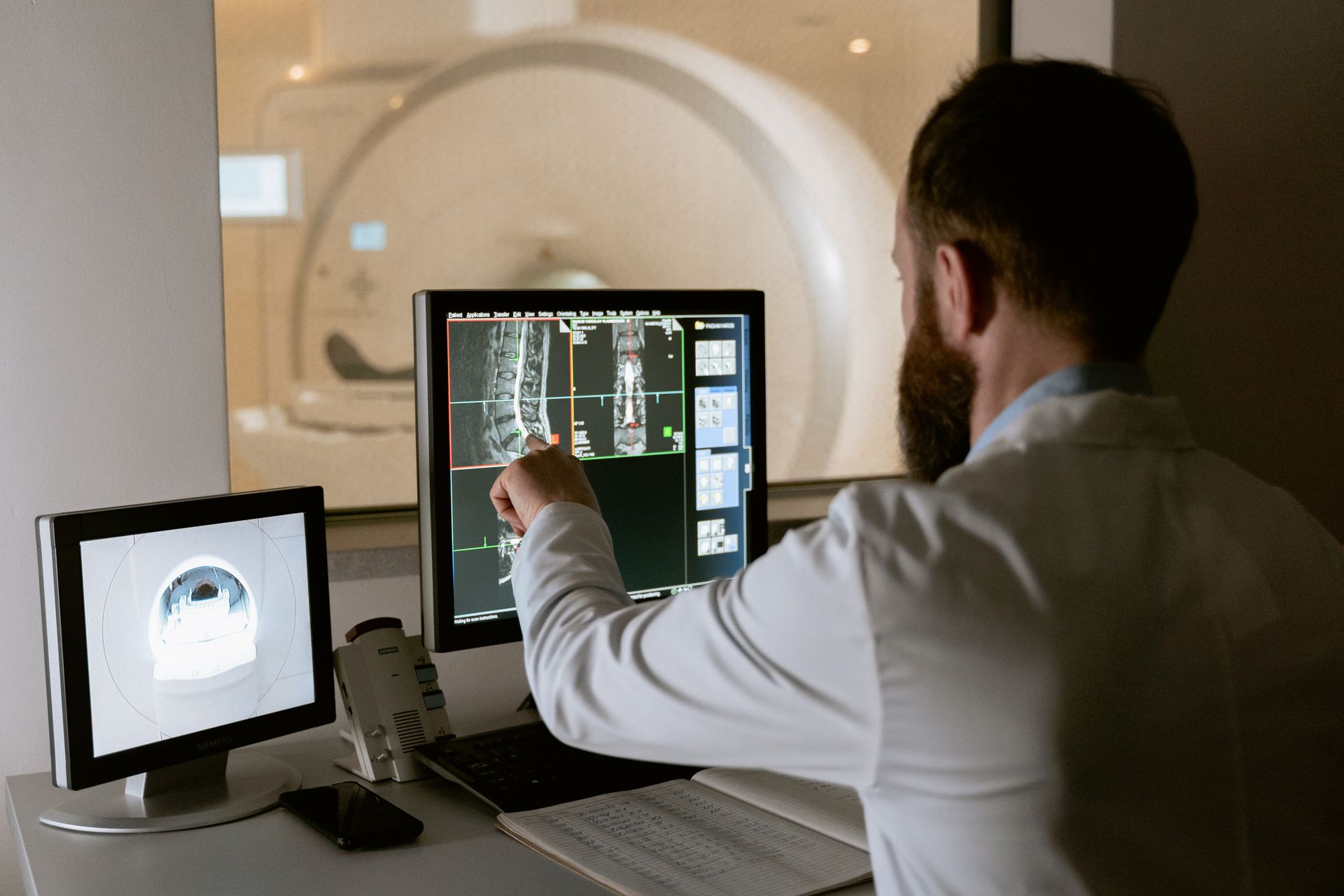 Healthcare professional reviewing diagnostic scans
